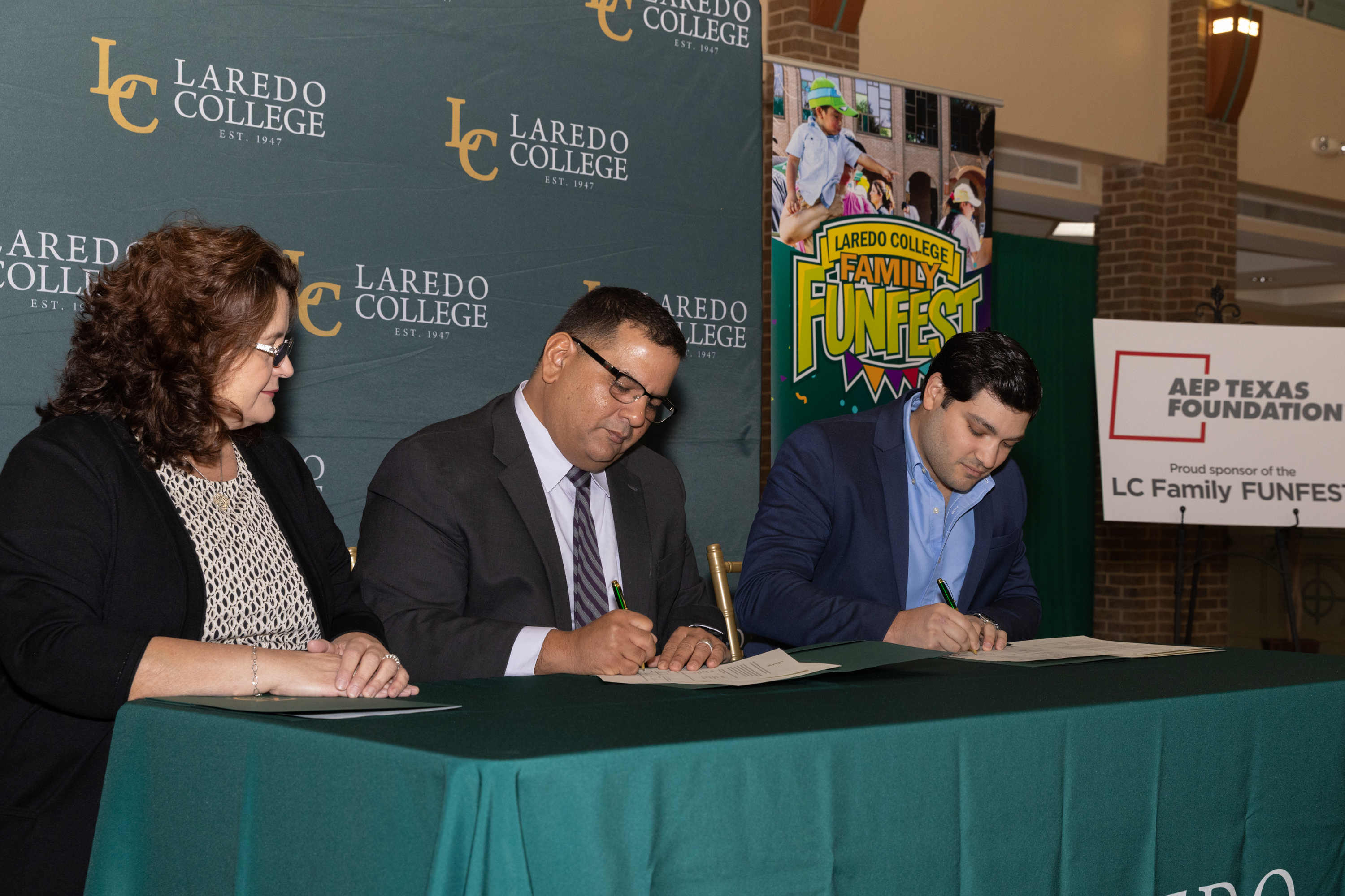 LC and AEP representatives sign documents
