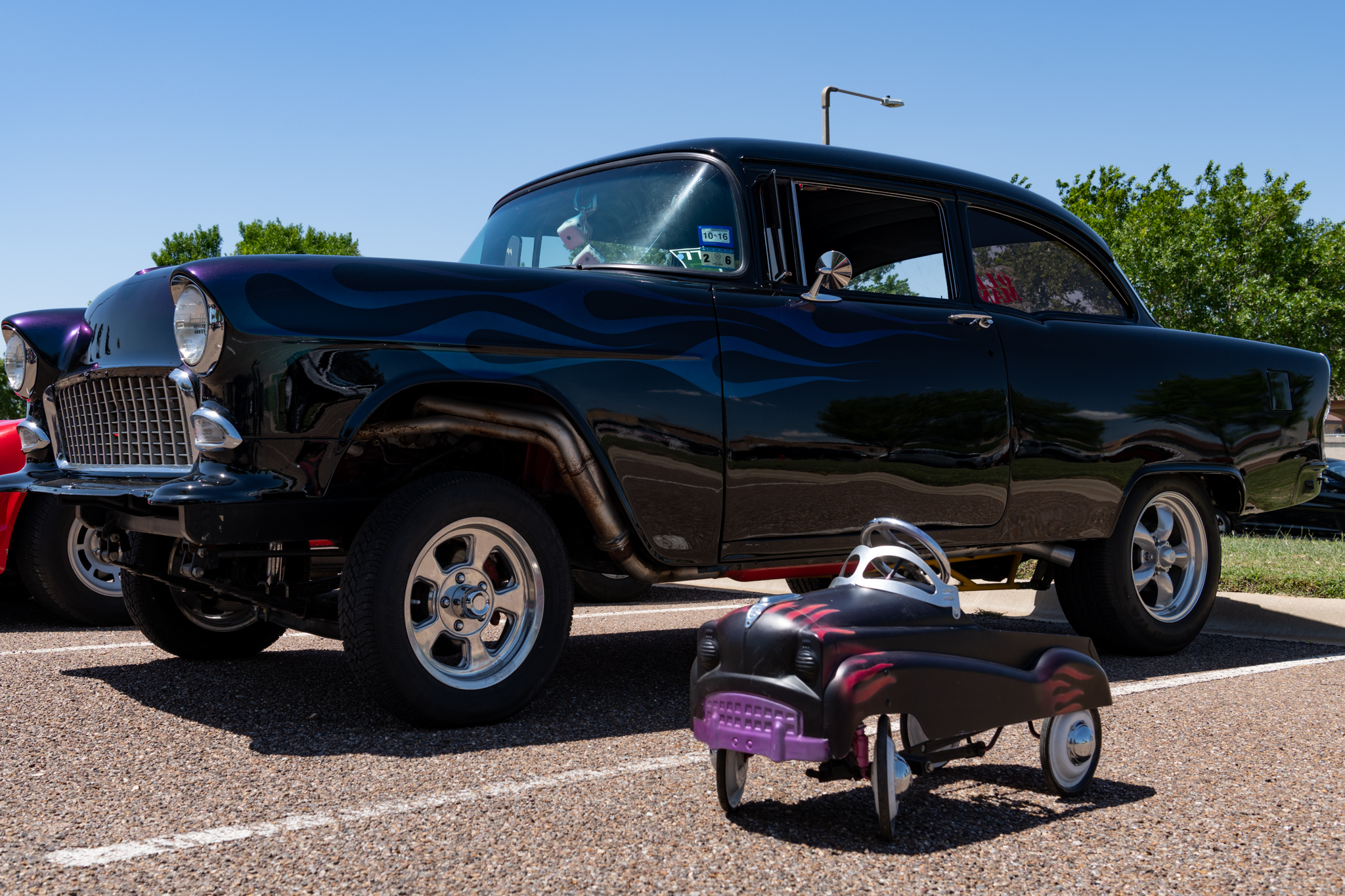 Local vehicle parked next to child's car toy