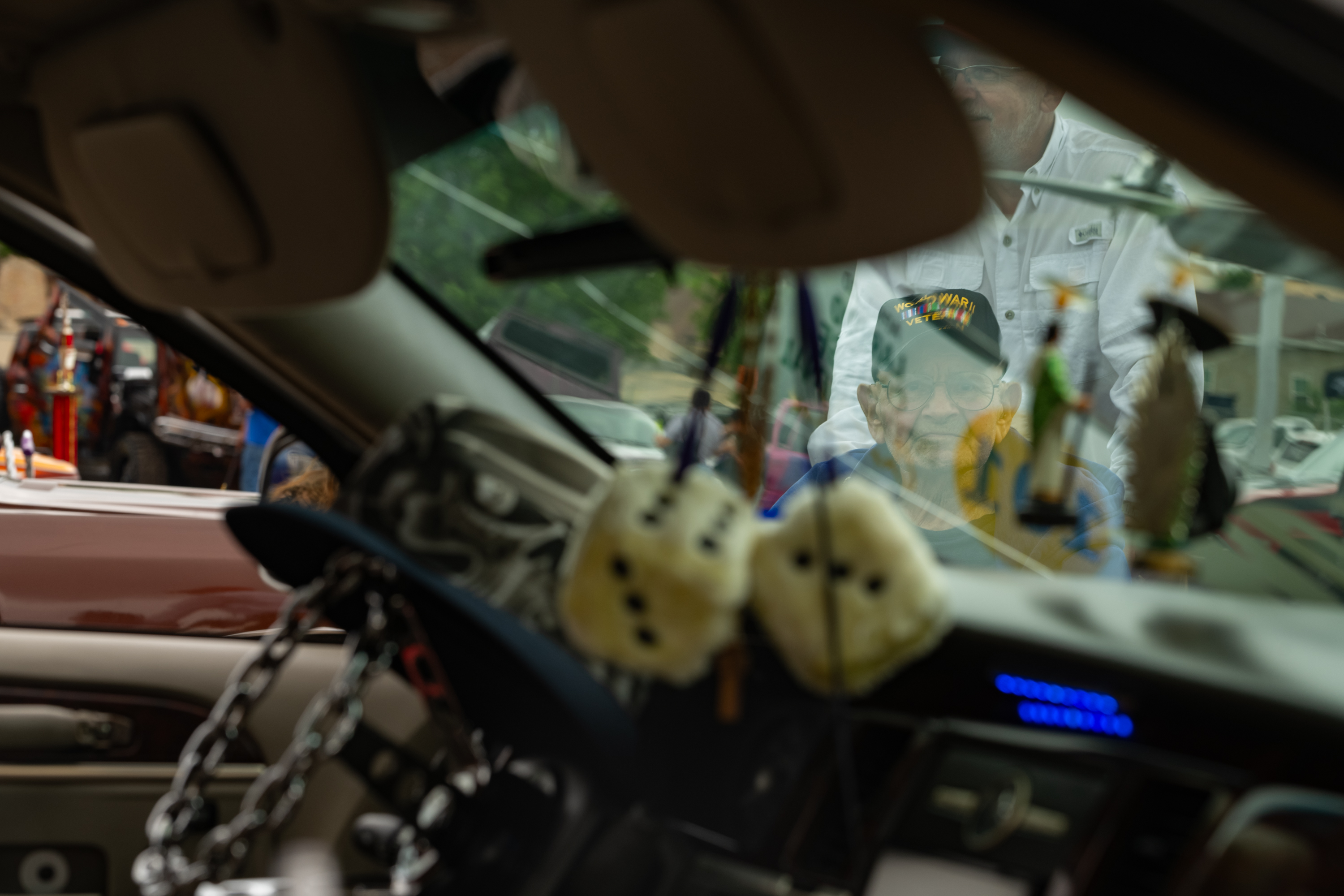 spectator looks through windshield of car